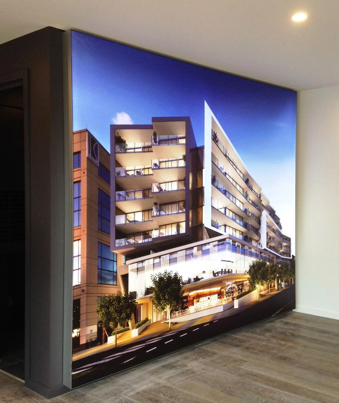 Large illuminated fabric light box installed on an interior wall